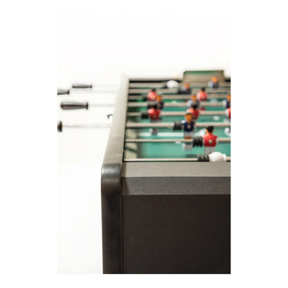 Close-up of a foosball table with players and rods on a white background