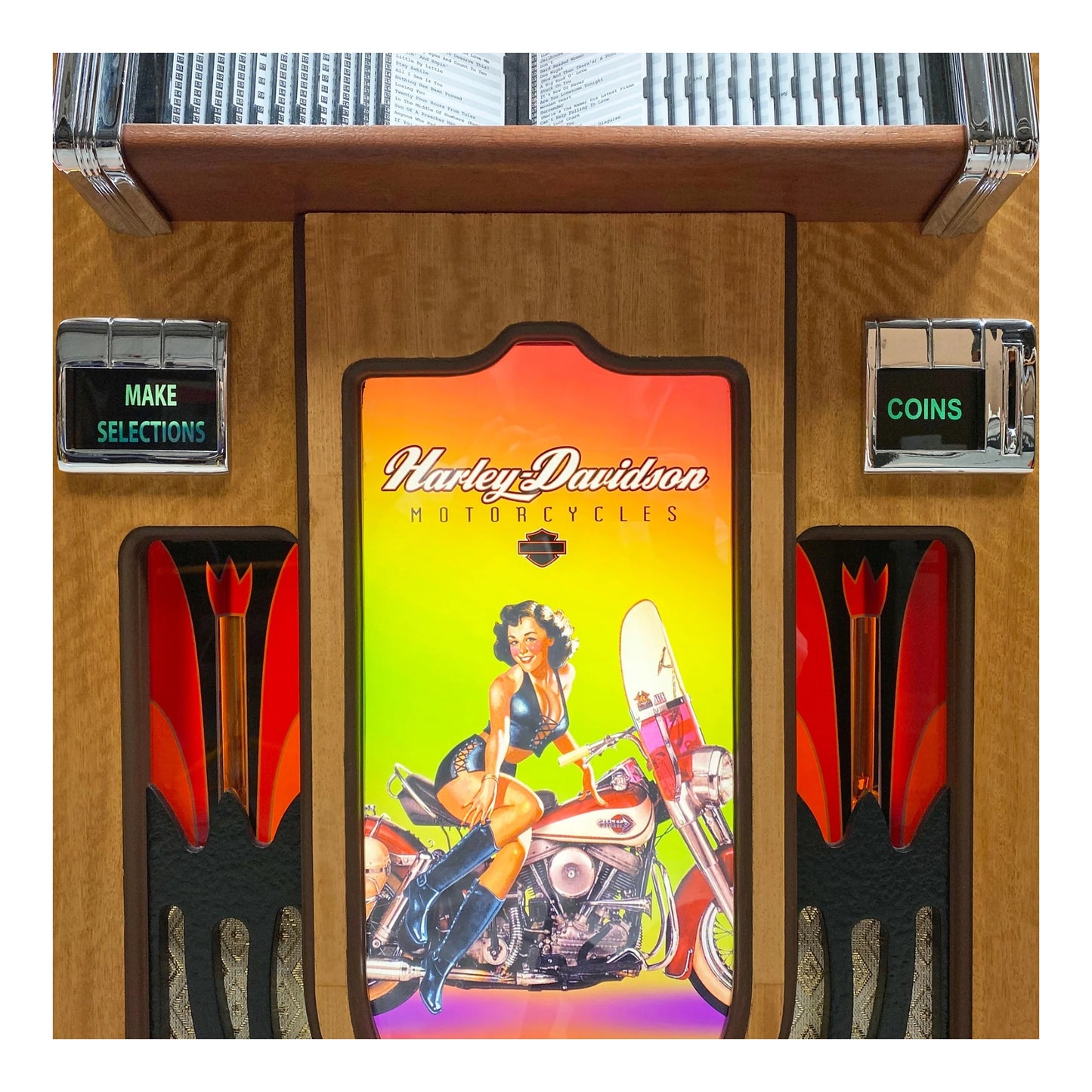 Vintage-style arcade machine with Harley Davidson branding and a pin-up girl on a motorcycle illustration.
