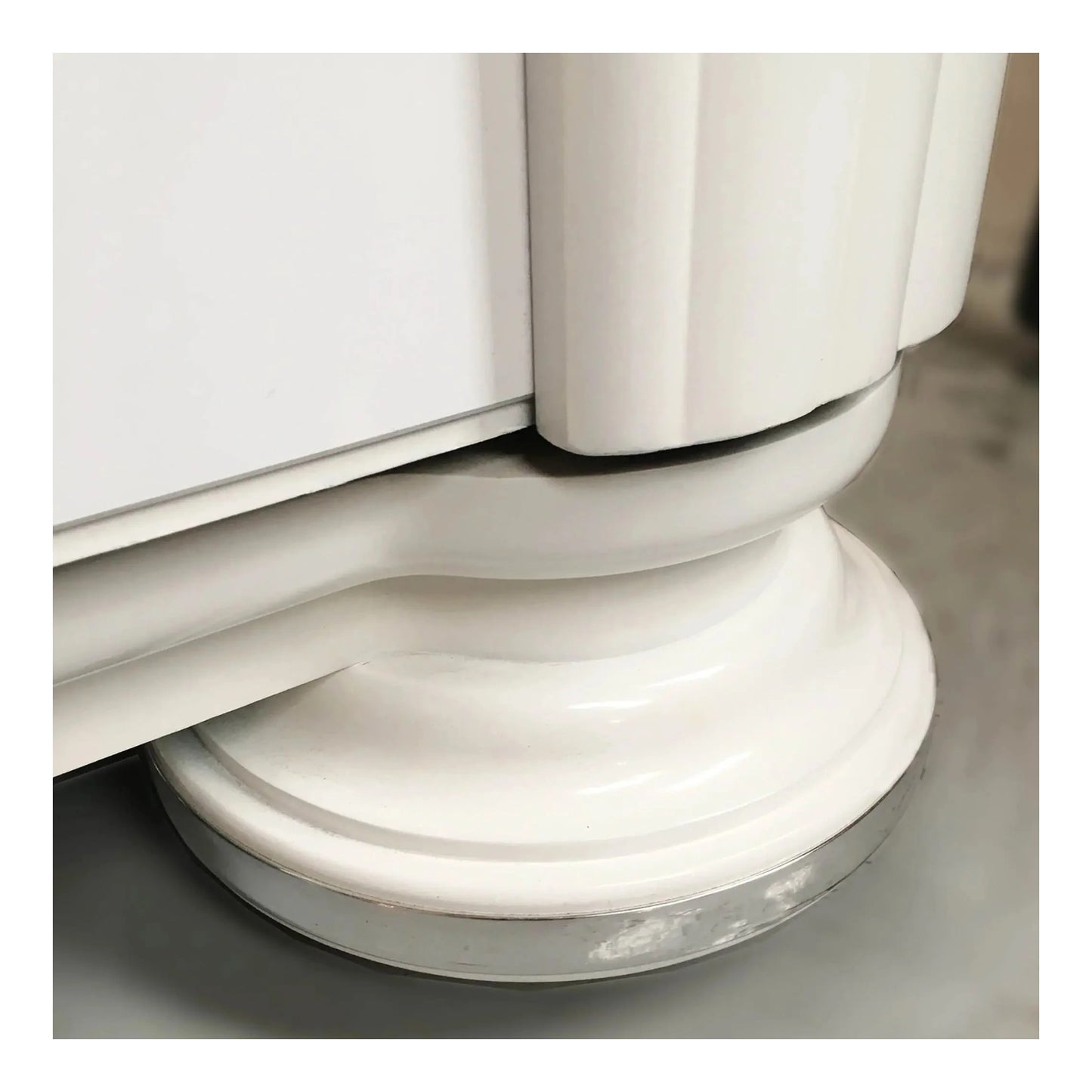 A styled shot of the Gloss White Bubbler in a modern room setting.
