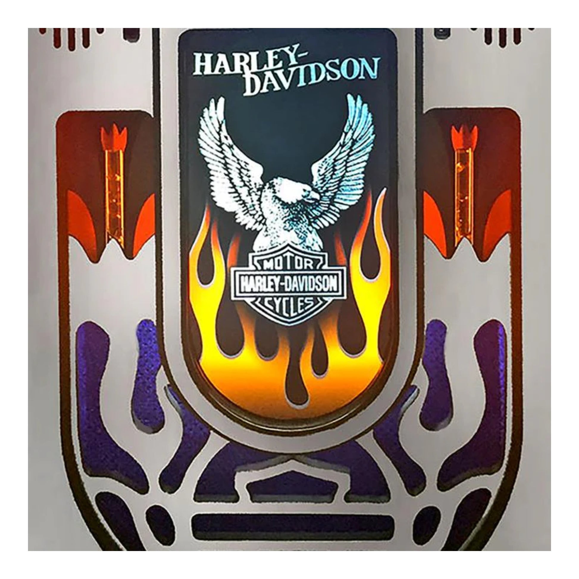 Harley-Davidson logo with an eagle and flames on a decorative background