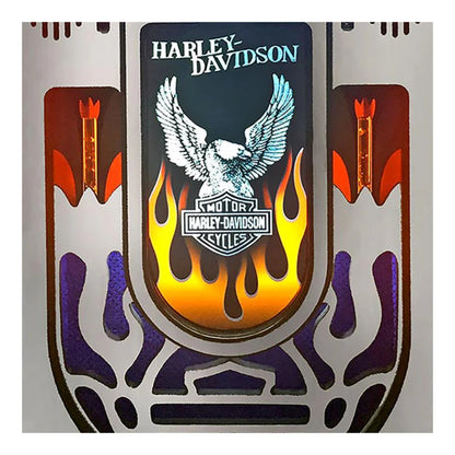 Harley-Davidson logo with an eagle and flames on a decorative background