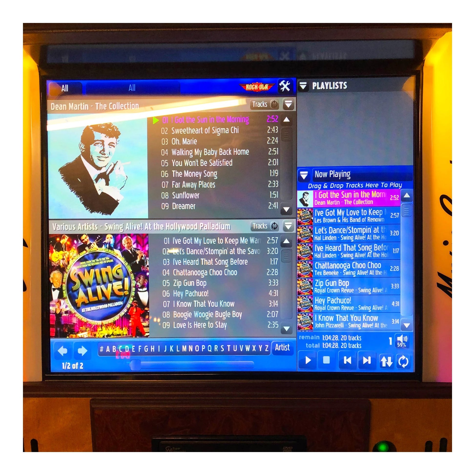 TV screen displaying a music player interface with a playlist and album art.