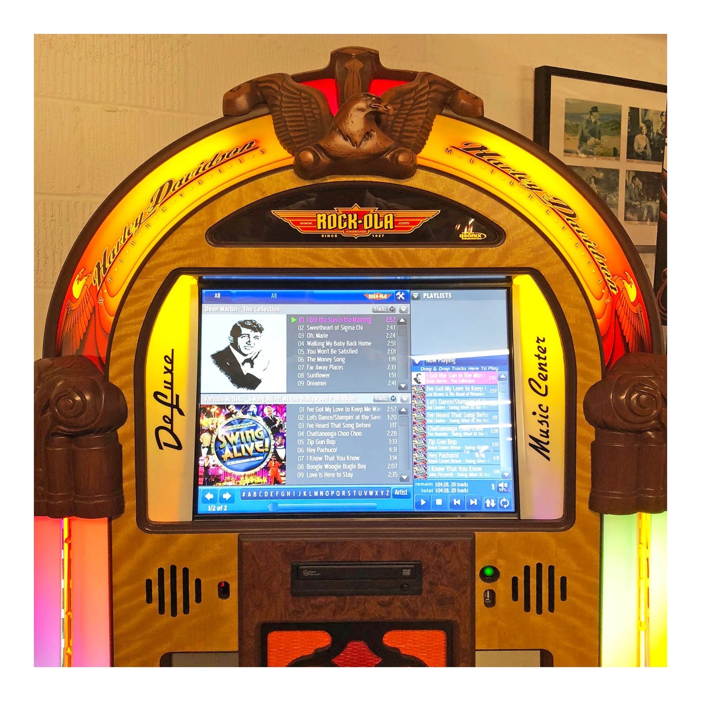 Vintage-style jukebox with digital screen displaying music menu