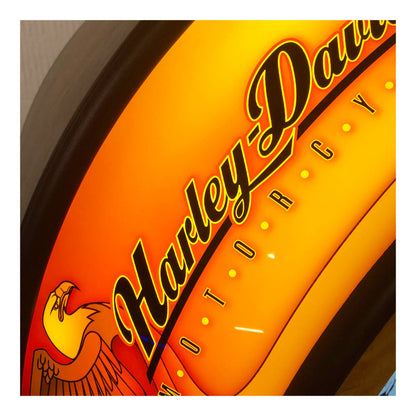 Harley-Davidson logo on a yellow background