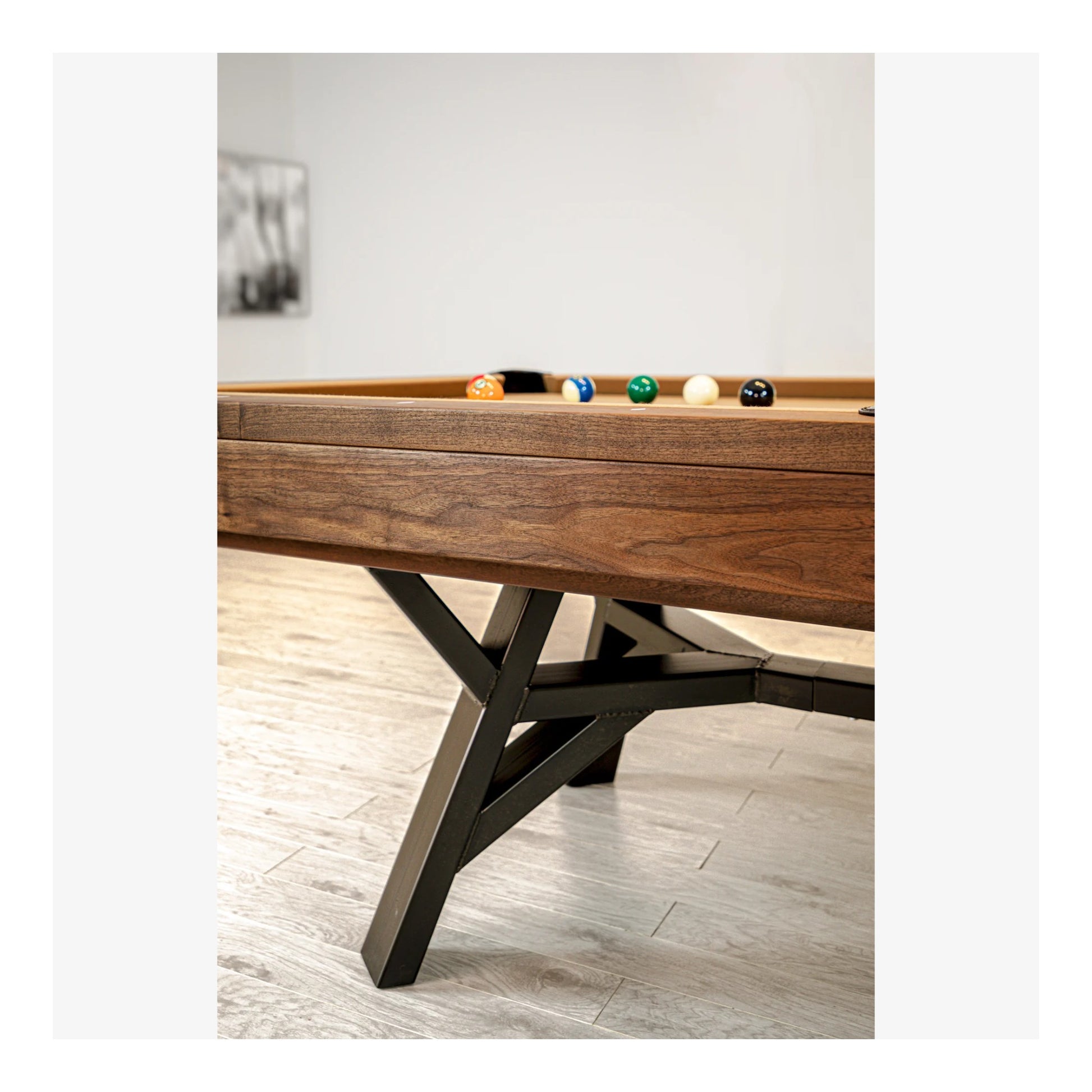 An alternate angle of the Industria pool table, showcasing its sleek, industrial design and grey felt surface.