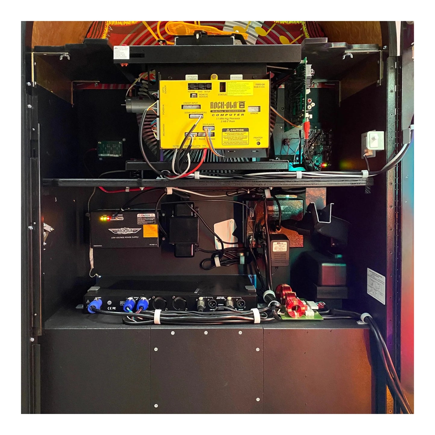 An interior view of the Rock-Ola jukebox, showing the 100-CD capacity magazine.