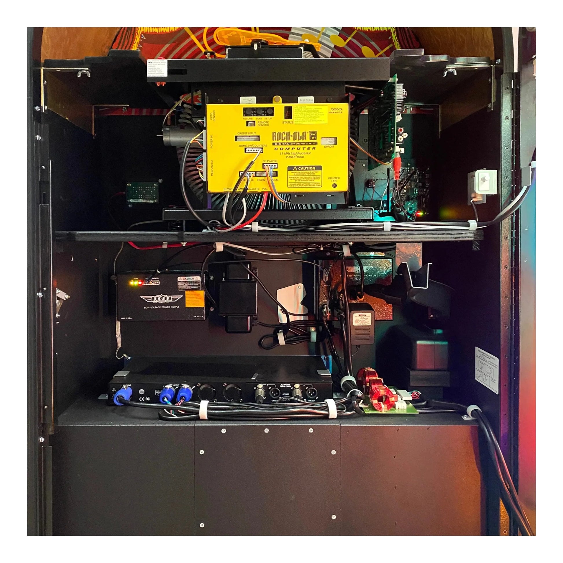 An interior view of the Rock-Ola jukebox, showing the 100-CD capacity magazine.