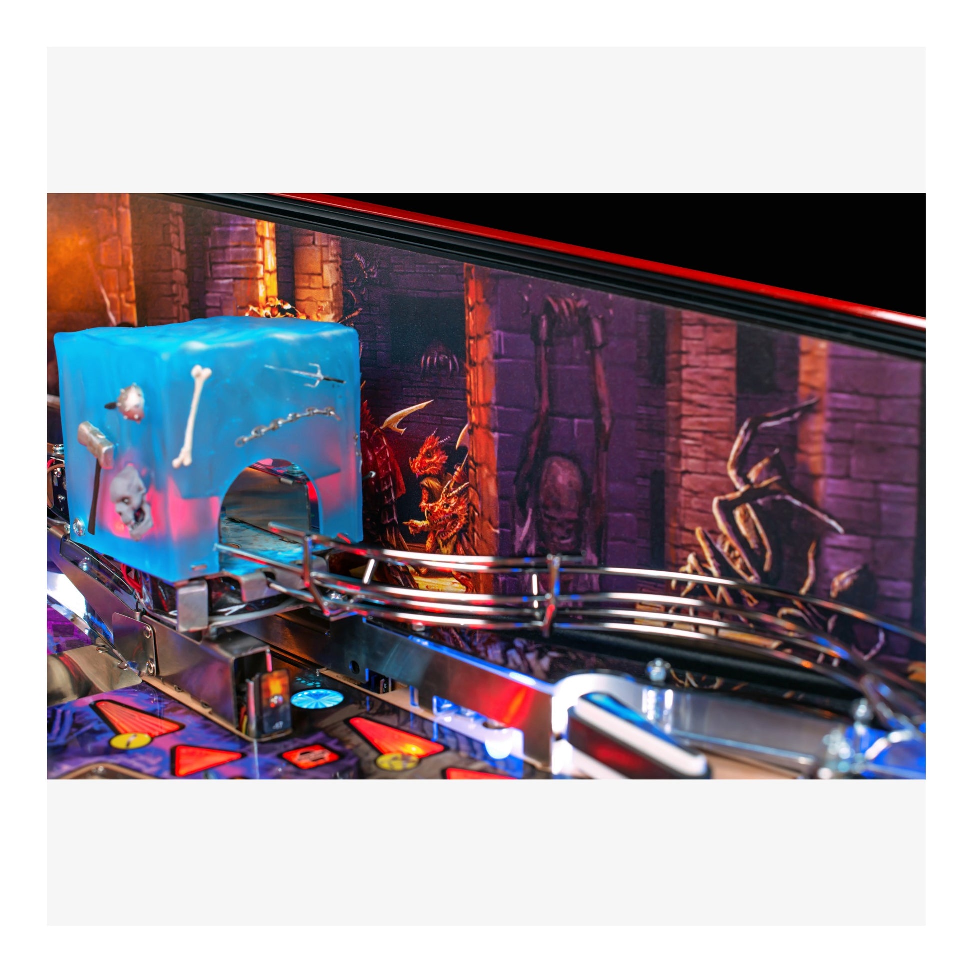 Close-up of a pinball machine with colorful playfield and vintage design elements.