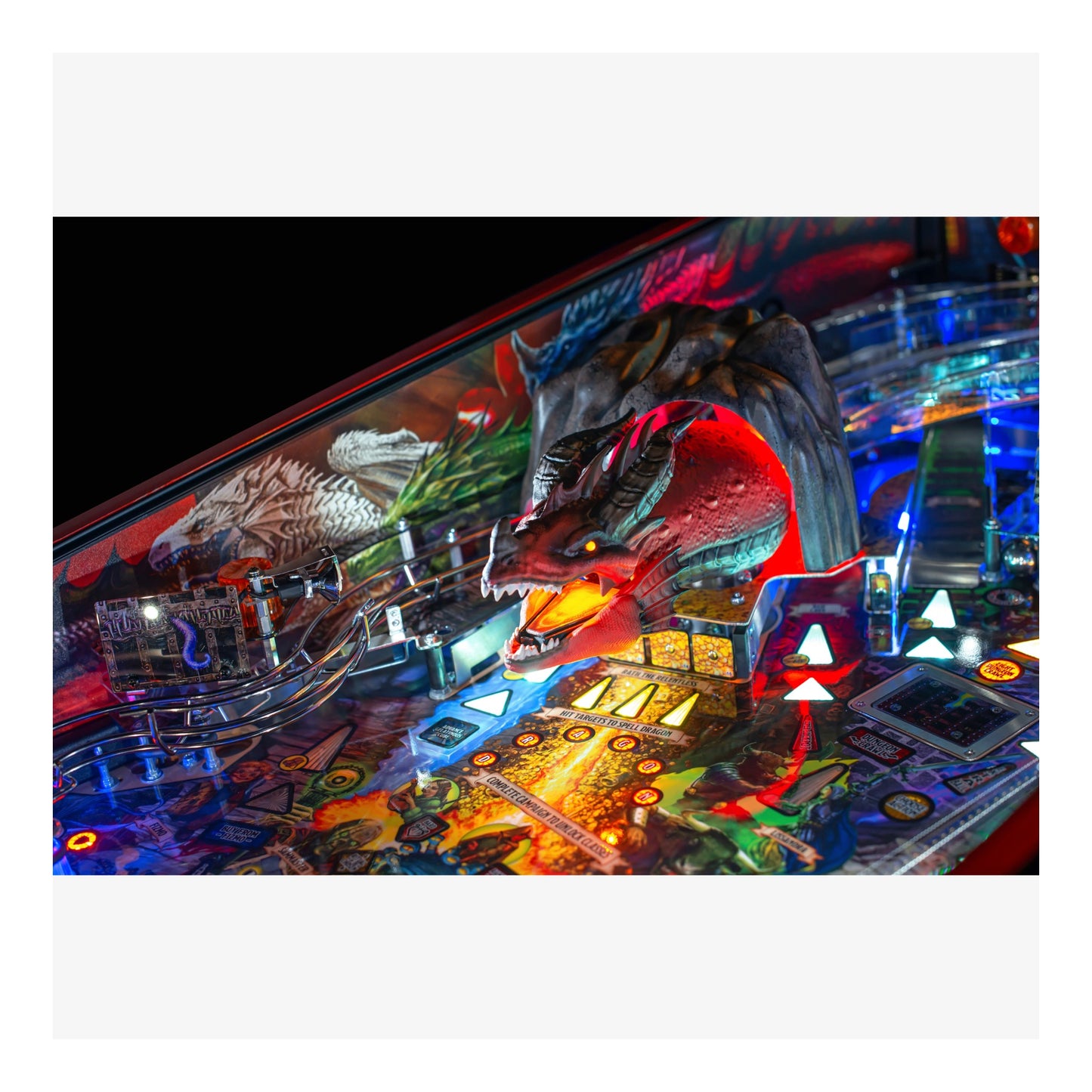 Close-up of a colorful pinball machine with detailed artwork and lights.