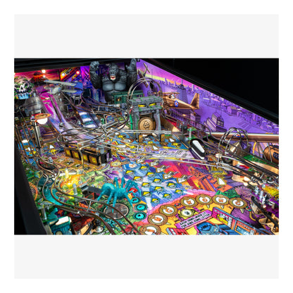 Colorful pinball machine with various elements and lights on a white background