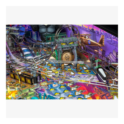 Colorful pinball machine with various elements and lights on a white background