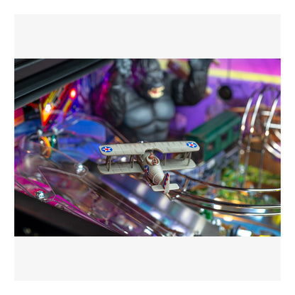 Pinball machine with a biplane figure and colorful background