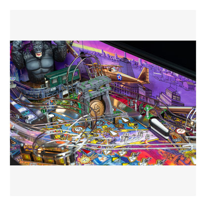 Pinball machine with colorful design and various elements on a white background
