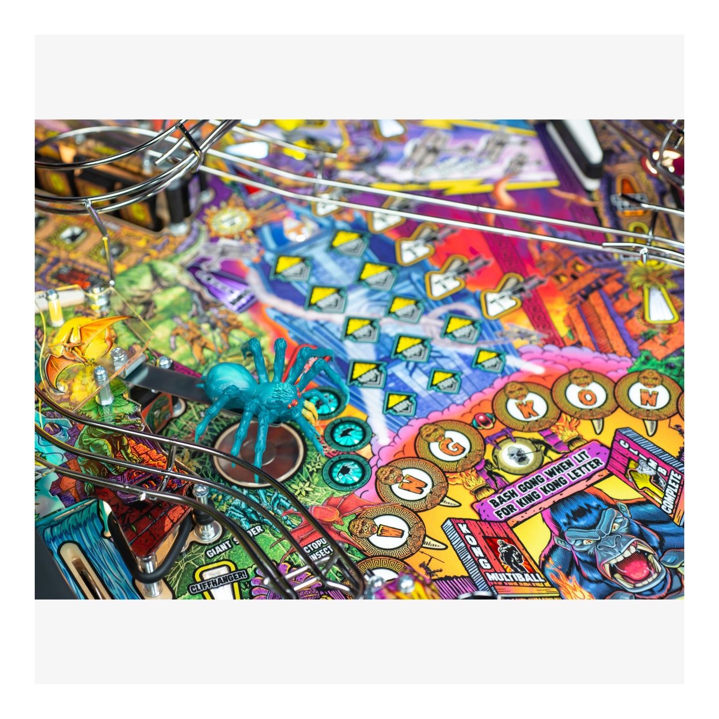 Colorful pinball machine with various symbols and designs on a white background