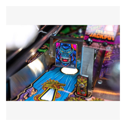 Close-up of a pinball machine with colorful artwork and text.