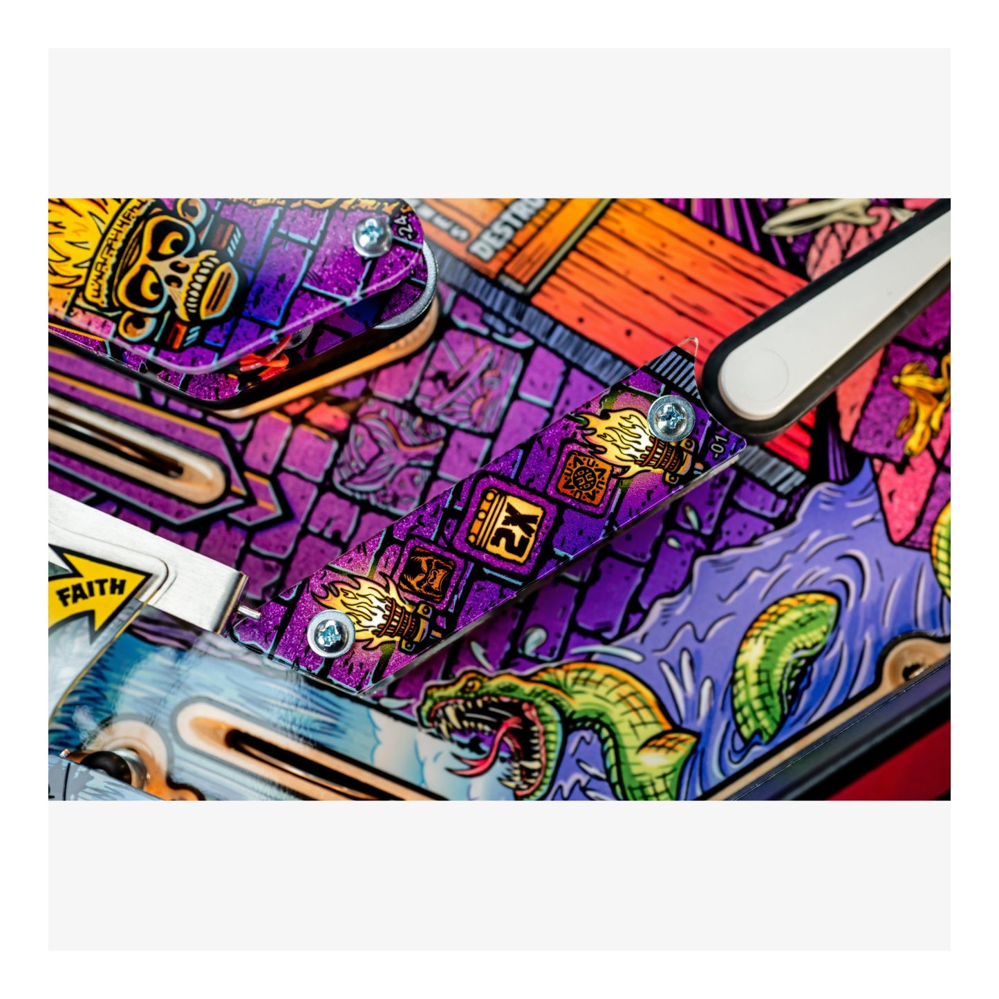 Colorful pinball machine with intricate designs and text on a white background