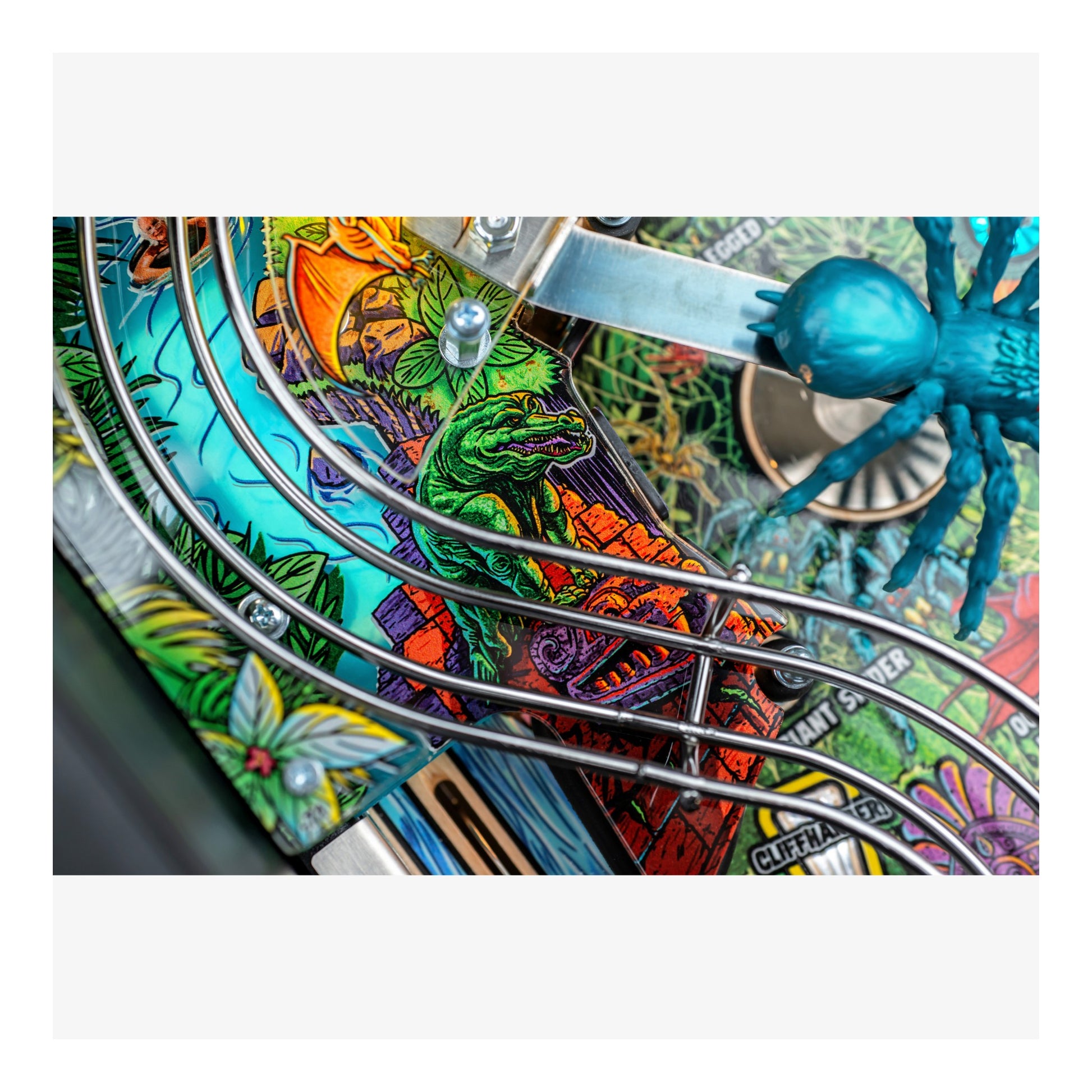 Colorful pinball machine with detailed artwork and a blue spider figure.