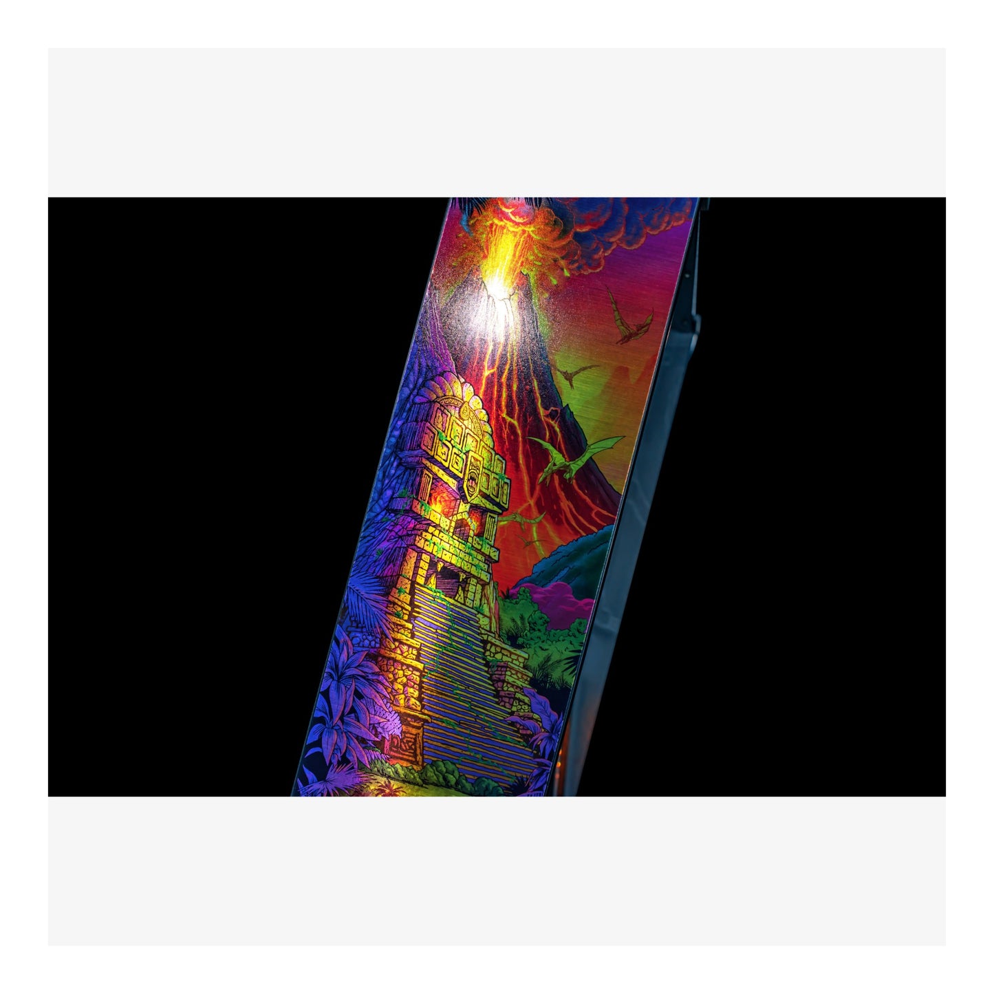Colorful skateboard deck with artistic design on a black background