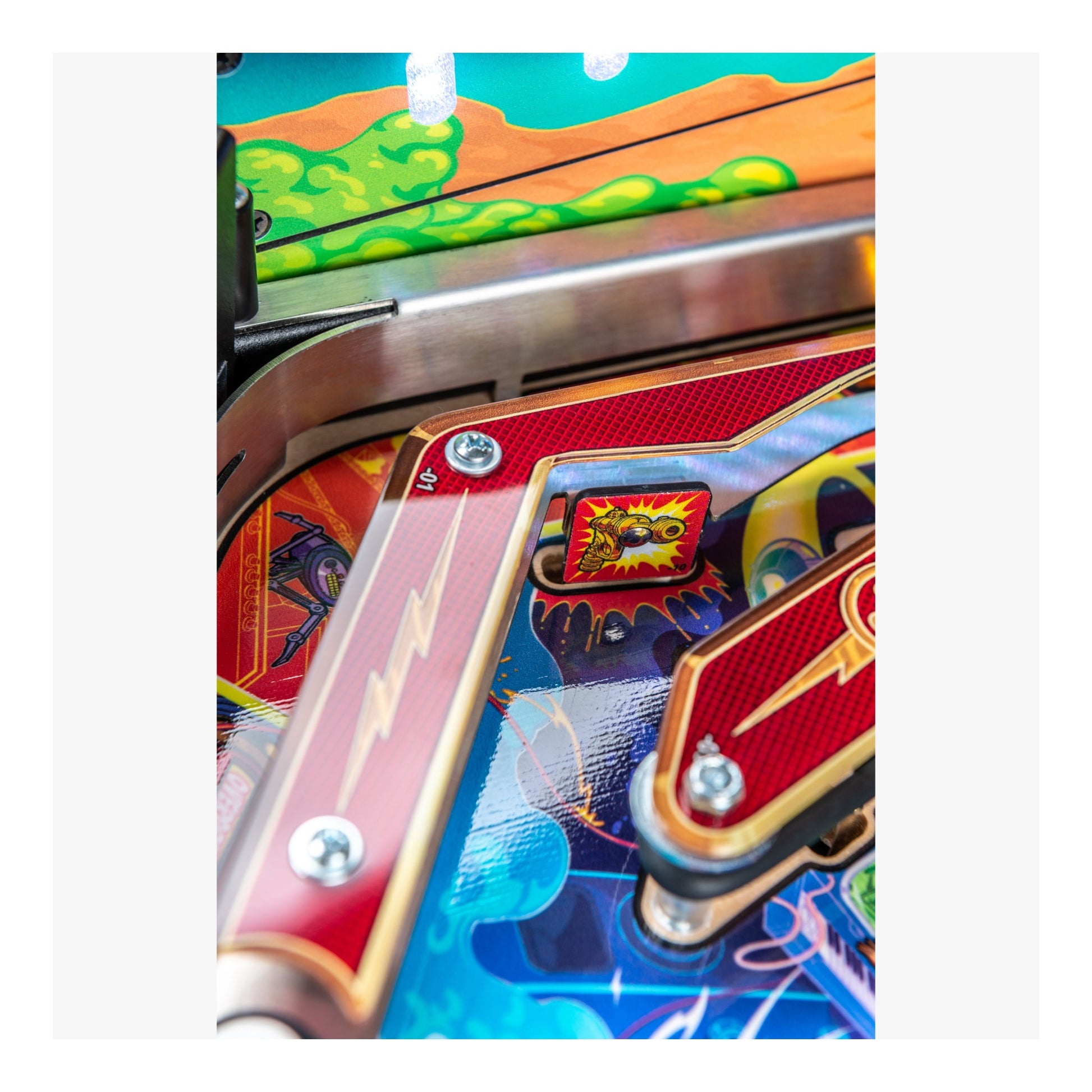 Close-up of a colorful pinball machine with vibrant graphics and metallic elements.