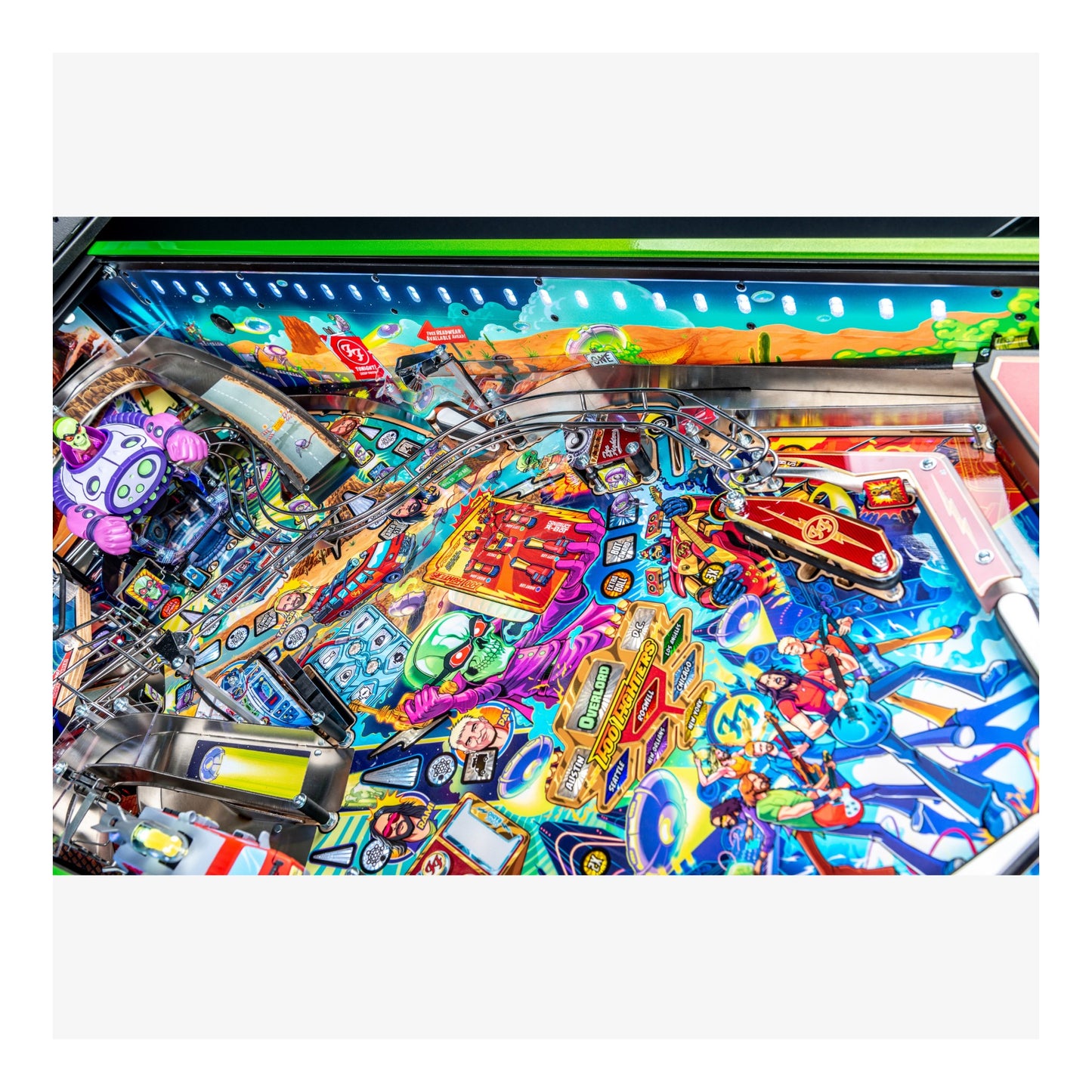 Colorful pinball machine with various symbols and designs on a white background