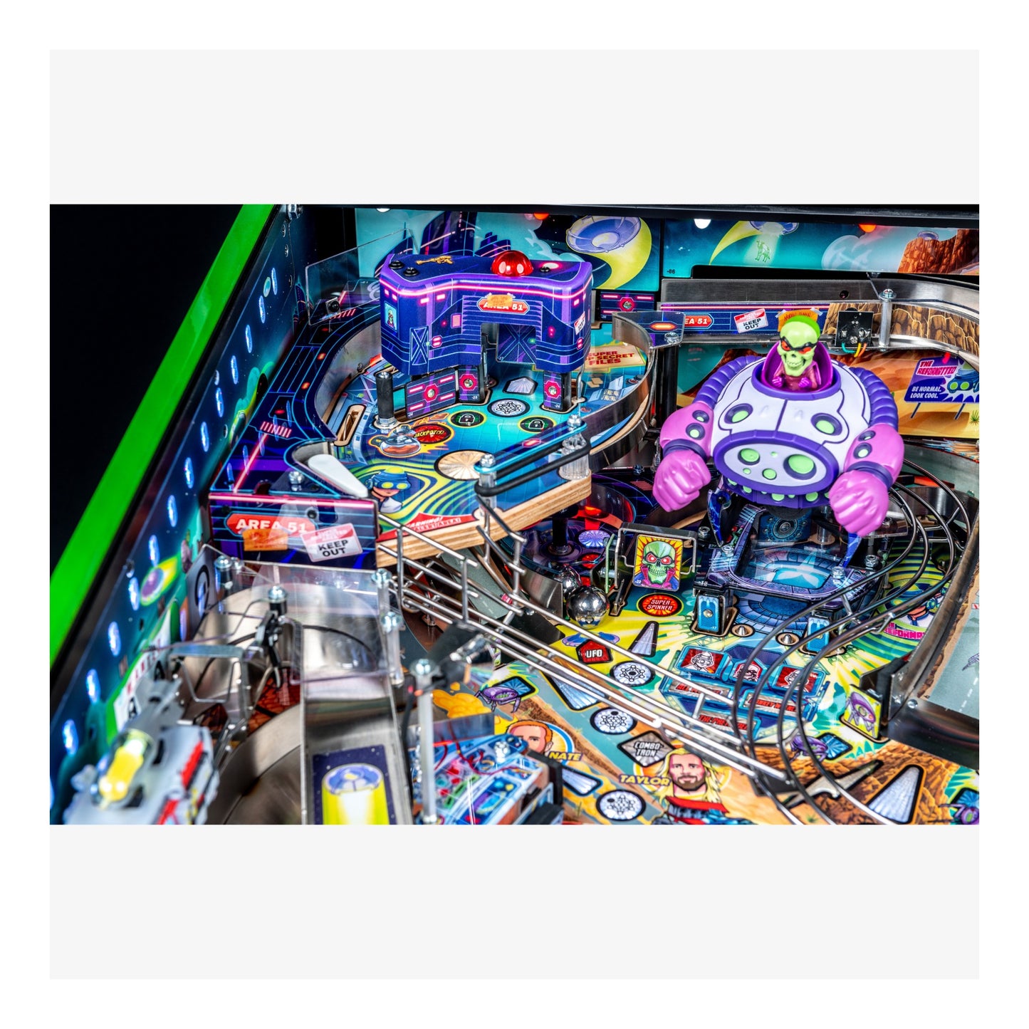 Colorful pinball machine with vibrant graphics and neon lights.