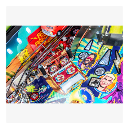 Close-up of a colorful pinball machine with various symbols and graphics.