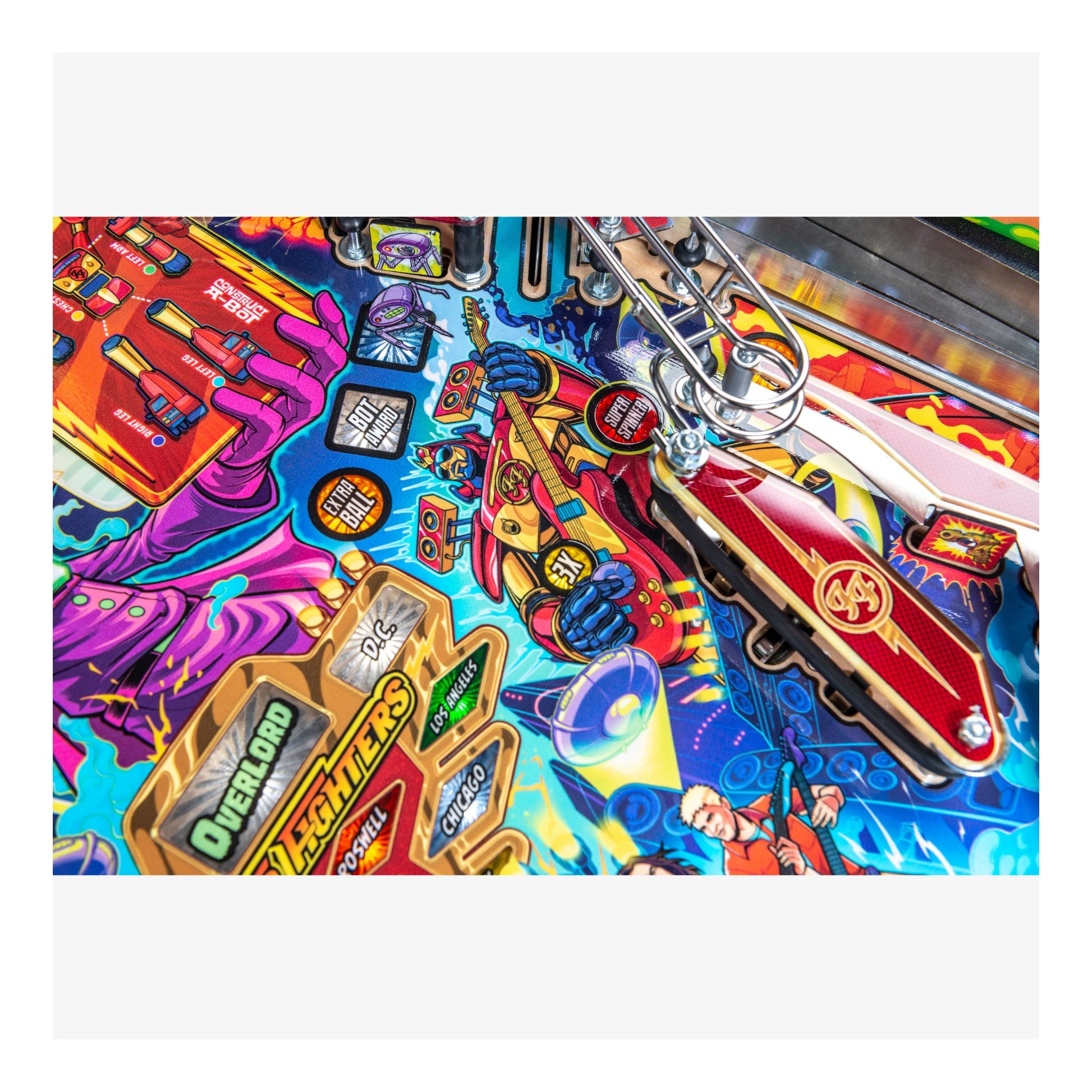 Colorful pinball machine with a keychain attached