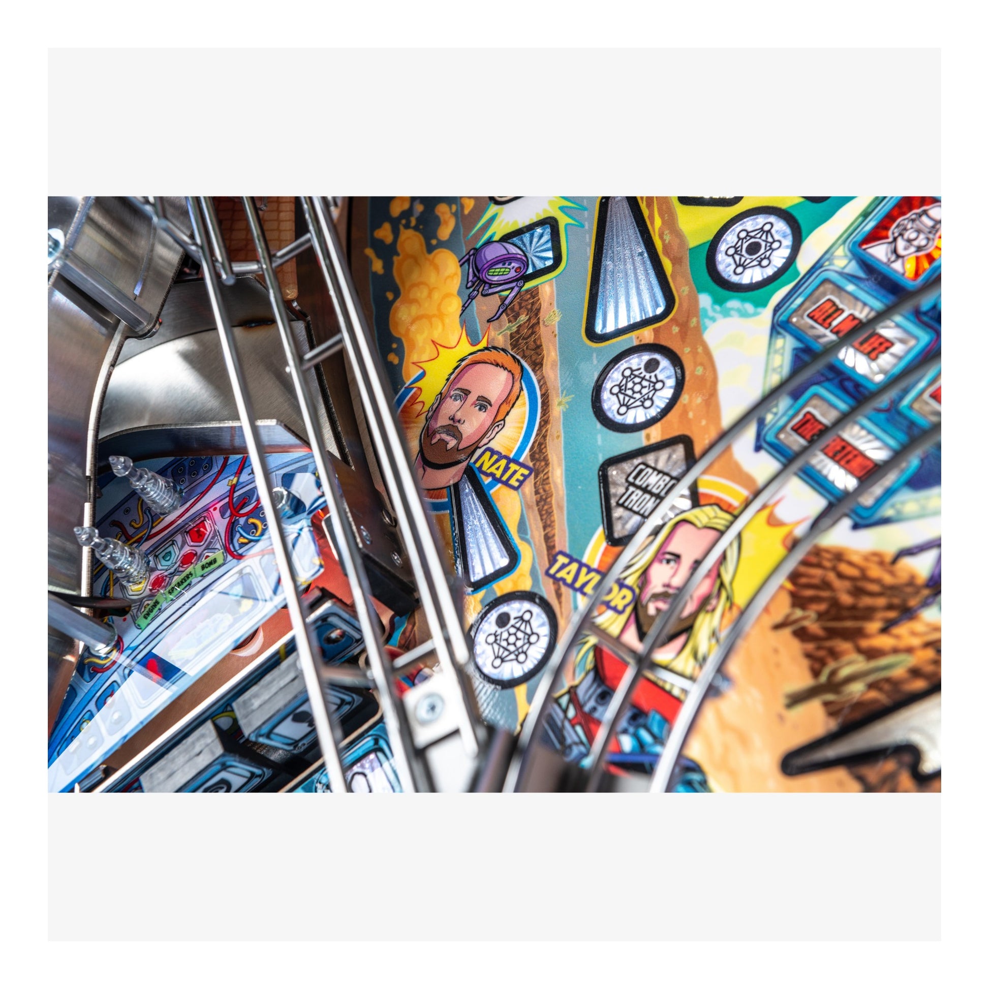 Colorful pinball machine with various symbols and images on a white background