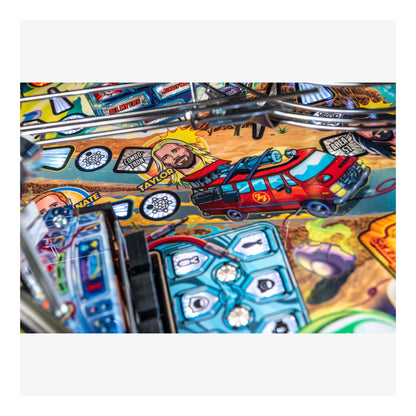 Close-up of a colorful pinball machine with various symbols and characters.