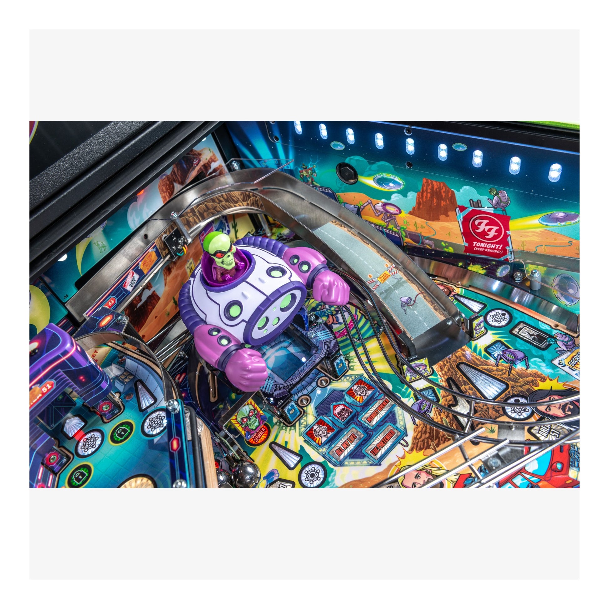 Colorful pinball machine with a robot figure and detailed layout