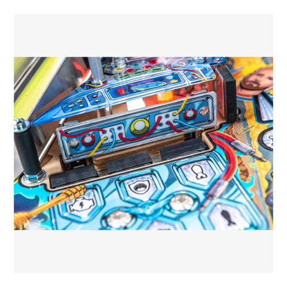 Close-up of a colorful pinball machine with detailed artwork and components.