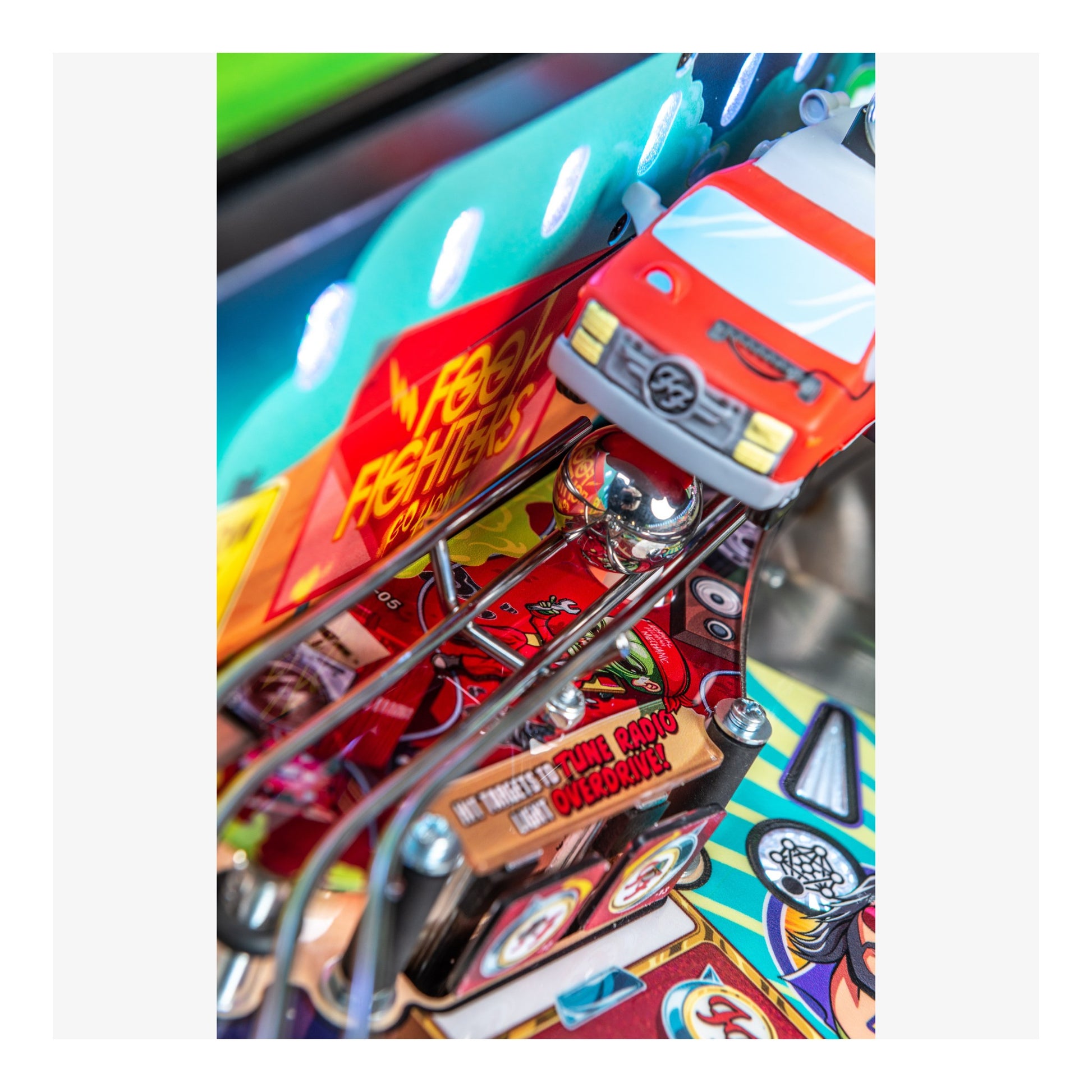 Close-up of a colorful pinball machine with a red car figure and 'Fast & Furry' text.