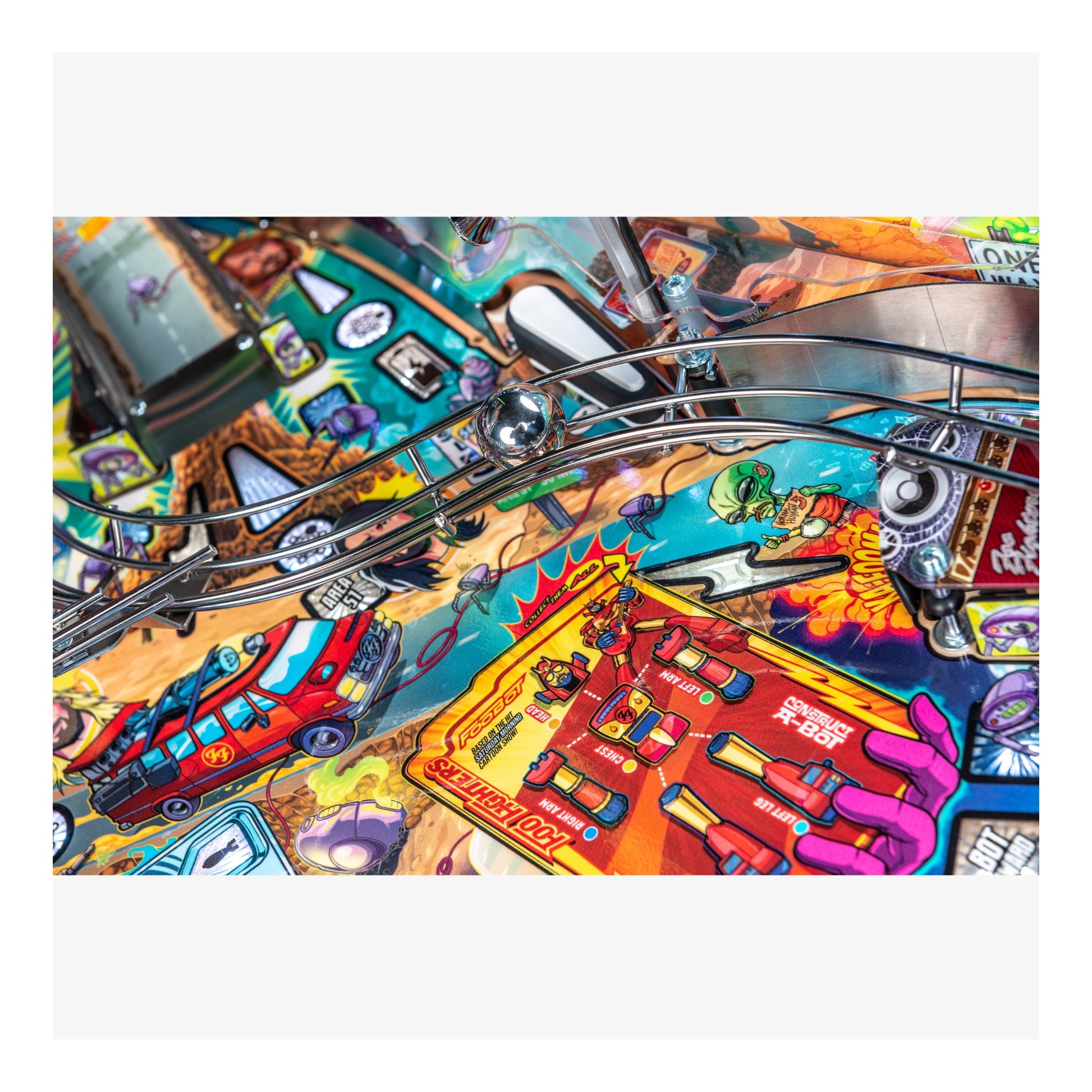 Close-up of a colorful pinball machine with various elements and graphics.