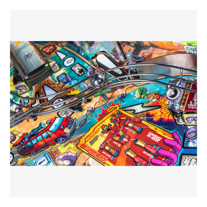 Close-up of a colorful pinball machine with various elements and graphics.