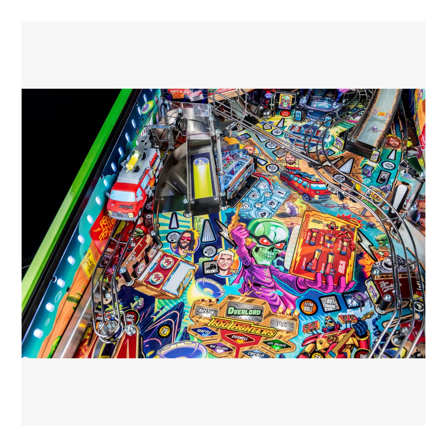 Colorful pinball machine with various symbols and designs on a white background