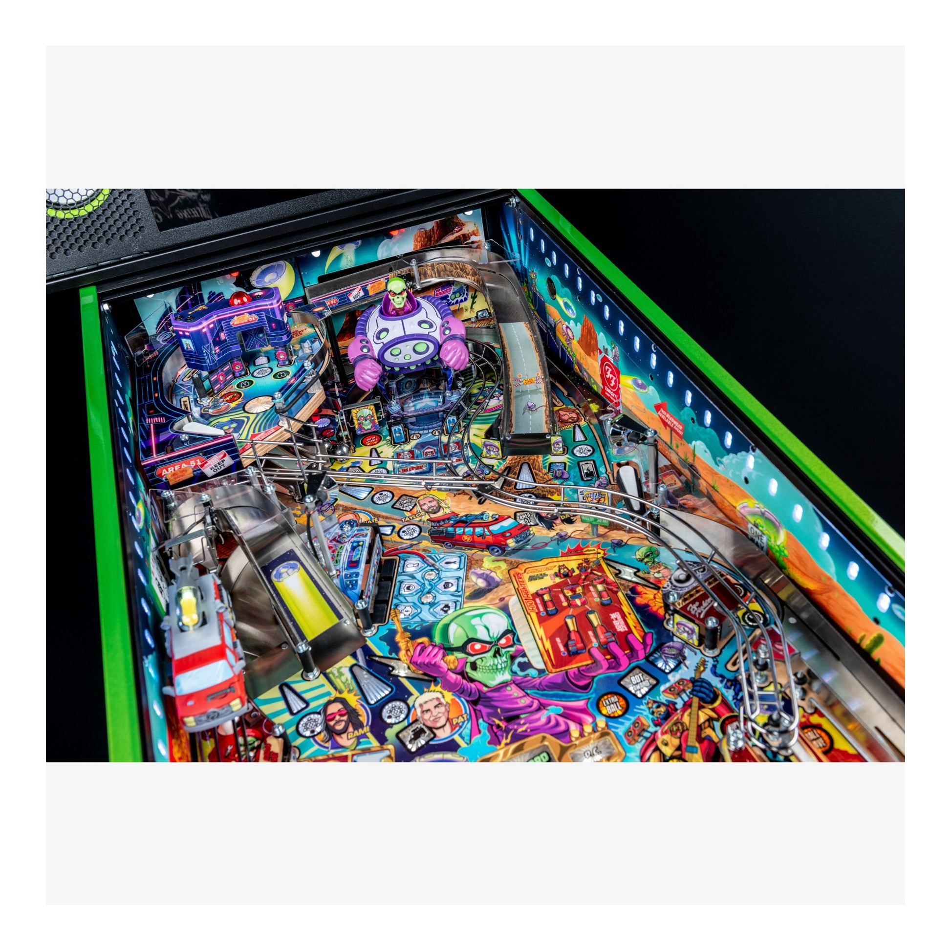 Colorful pinball machine with detailed artwork and bright lights.