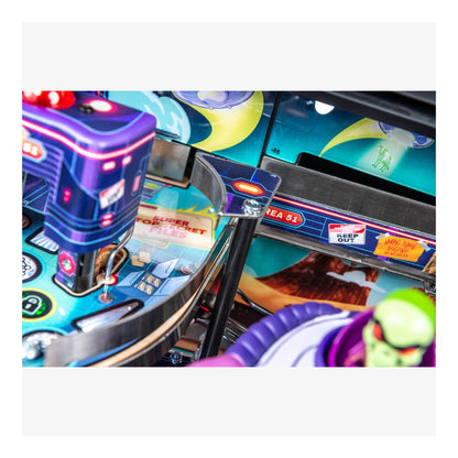 Close-up of a colorful pinball machine with vibrant graphics and neon lights.