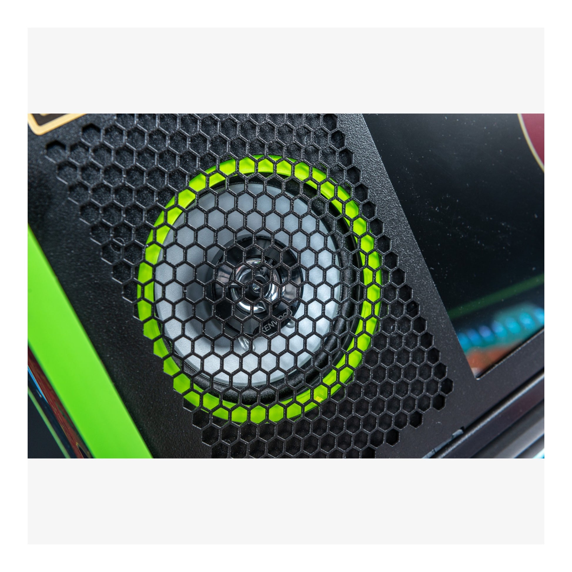 Close-up of a computer cooler with honeycomb design and green accents