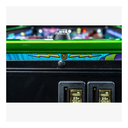 Close-up of a pinball machine with colorful design and control buttons.