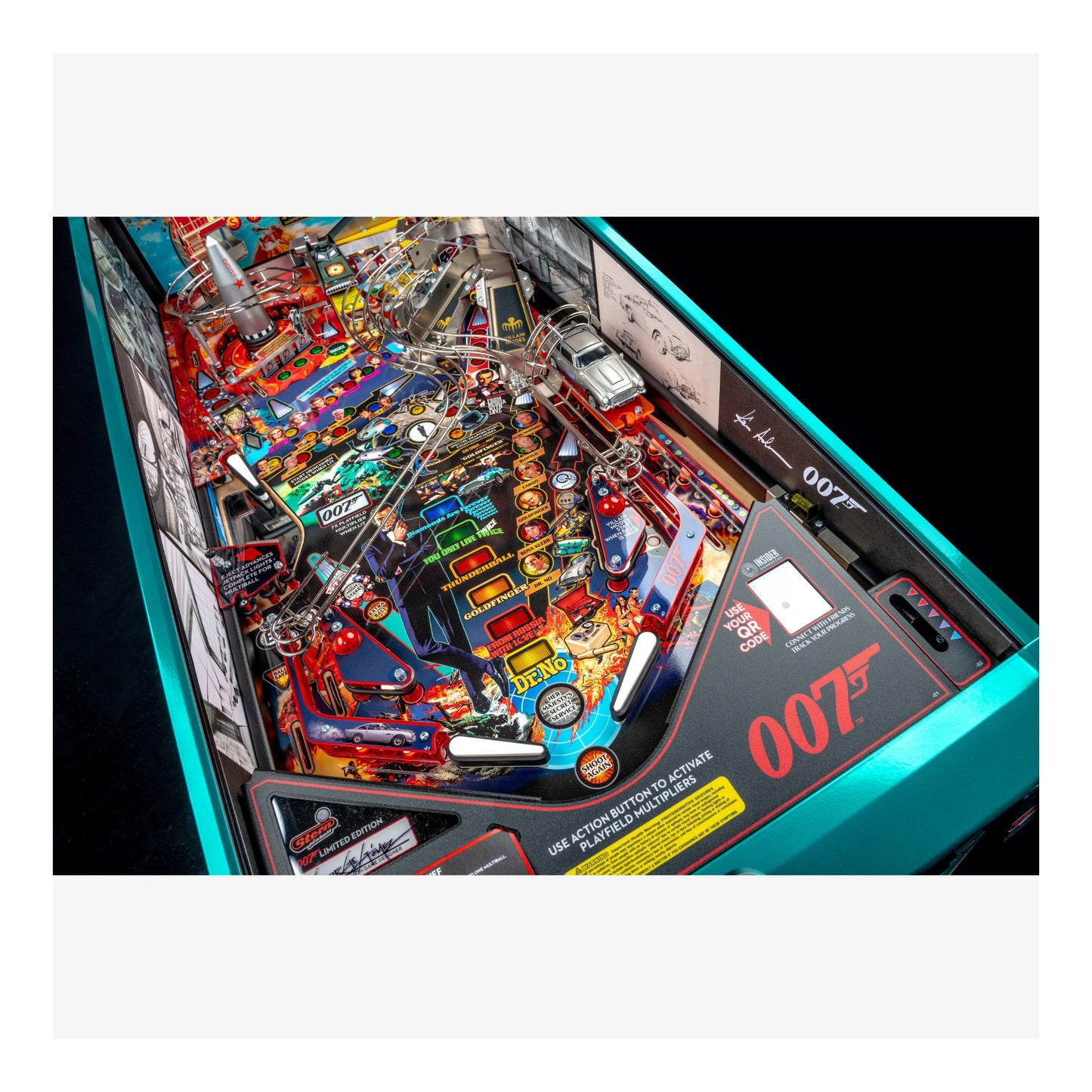 Close-up of a pinball machine with detailed artwork and '007' branding.