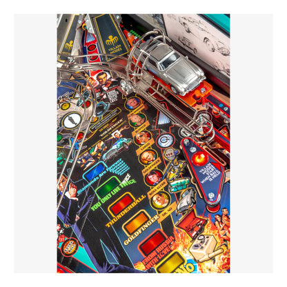 Close-up of a colorful pinball machine with various symbols and characters on a white background