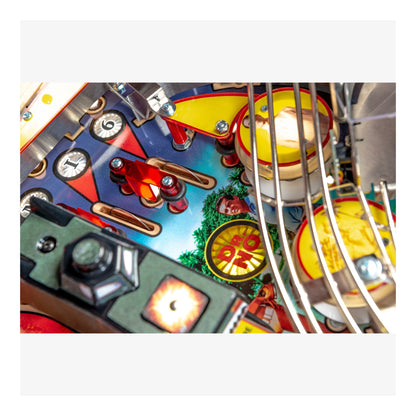 Close-up of a colorful pinball machine with various components.