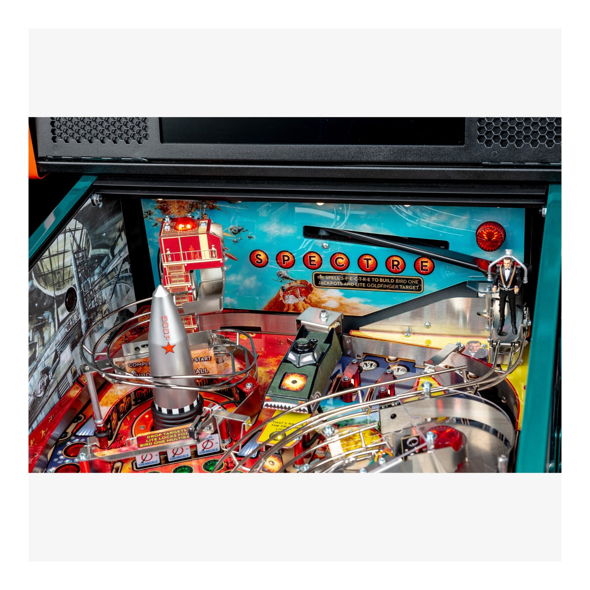 Close-up of a pinball machine with colorful design and 'Dexter' branding.