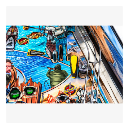 Close-up of a colorful pinball machine with various symbols and graphics.