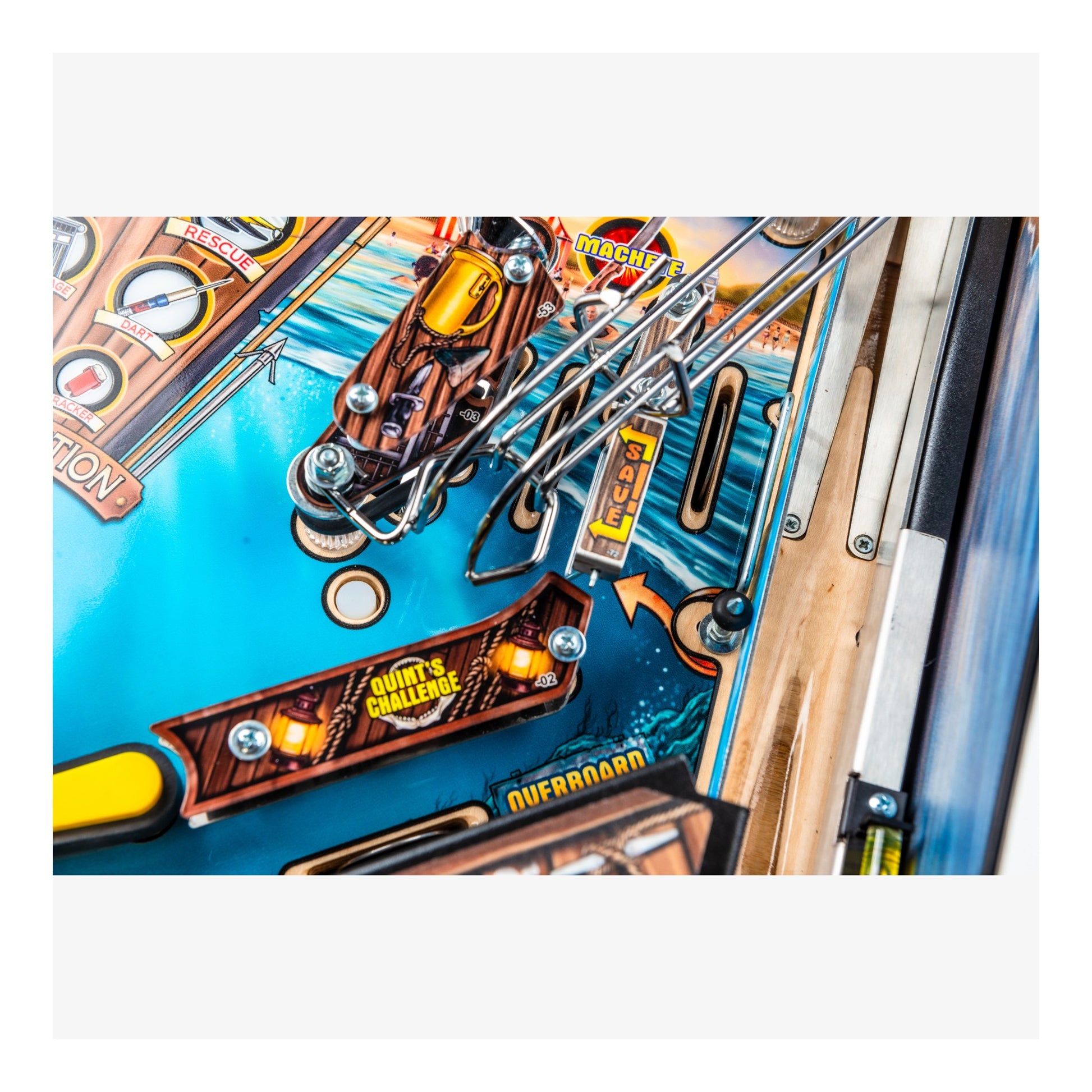 Close-up of a pinball machine with colorful details and text.