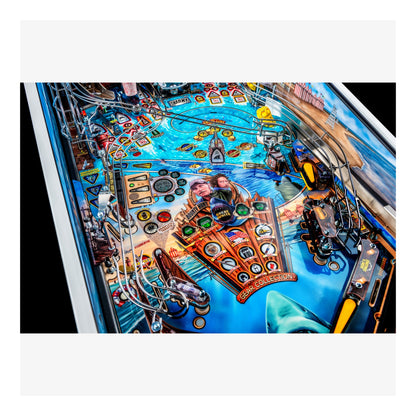 Close-up of a pinball machine with detailed artwork and components.