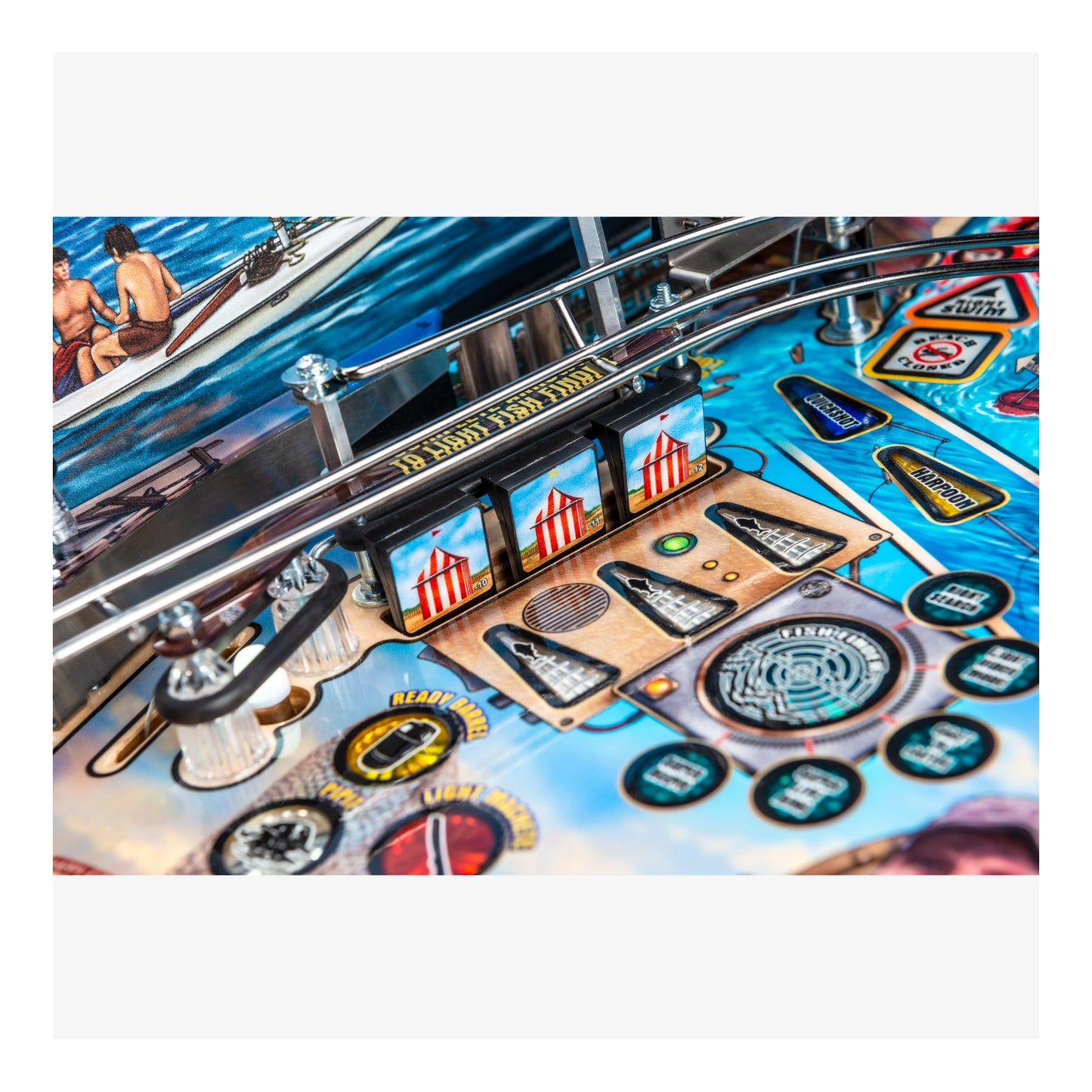 Close-up of a pinball machine with colorful artwork and playing field