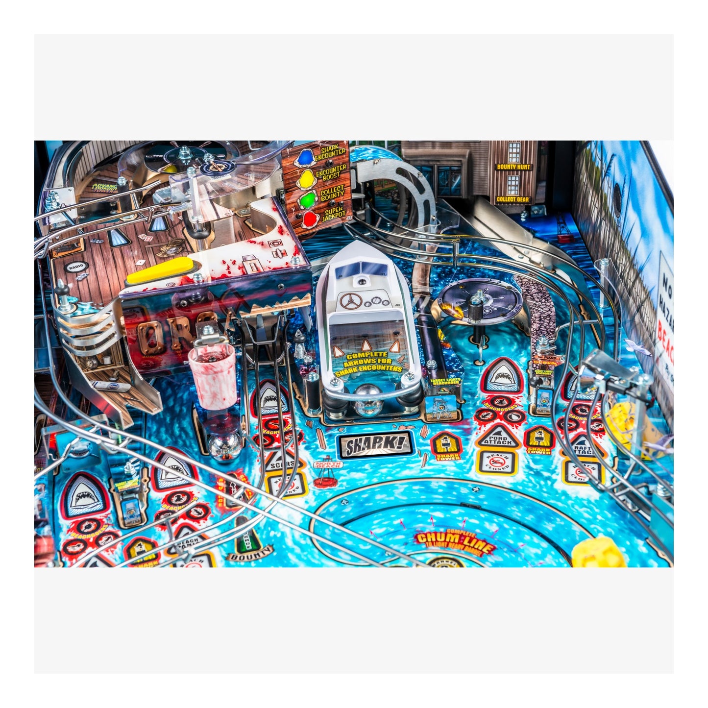 Pinball machine with colorful design and various symbols on a white background
