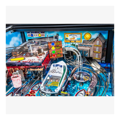 Close-up of a pinball machine with detailed artwork and playfield.