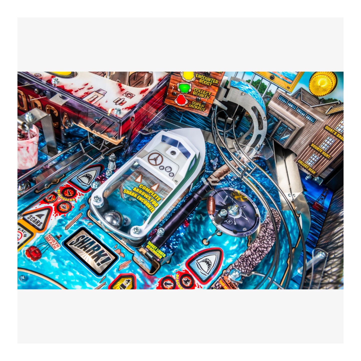 Close-up of a pinball machine with detailed artwork and components.